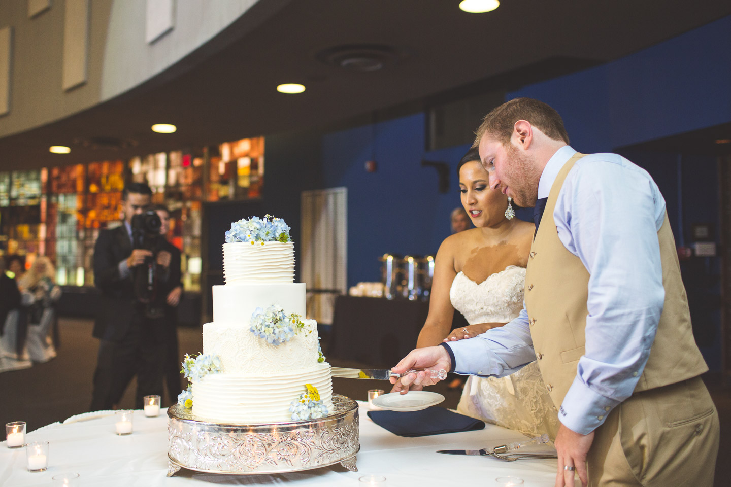 silver-garden-events-center-michigan-southfield-bride-groom-cut-cake