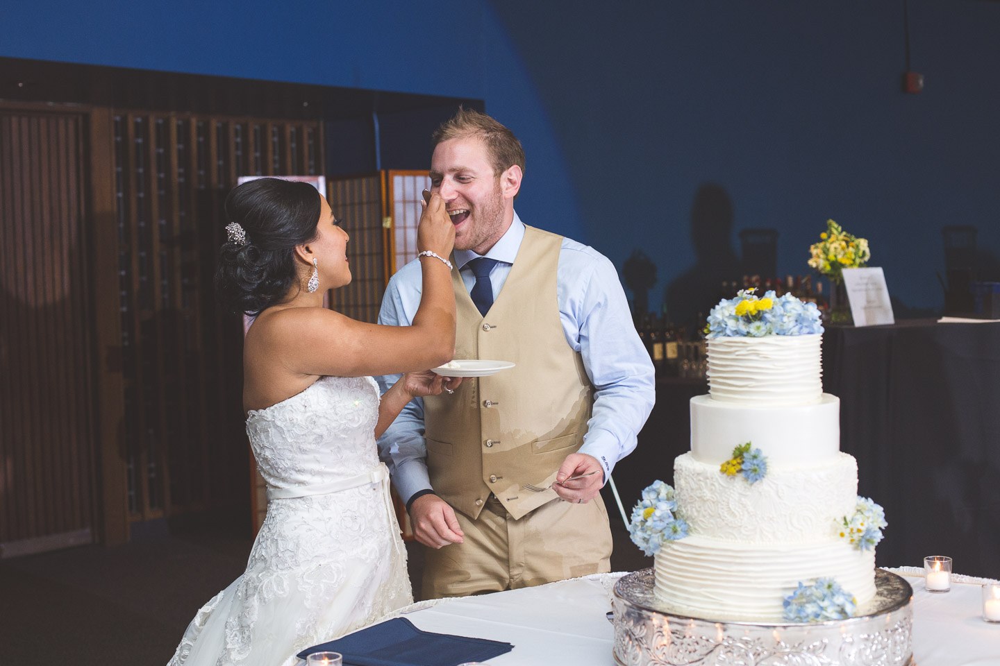 silver-garden-events-center-michigan-southfield-bride-groom-feed-eat-cake