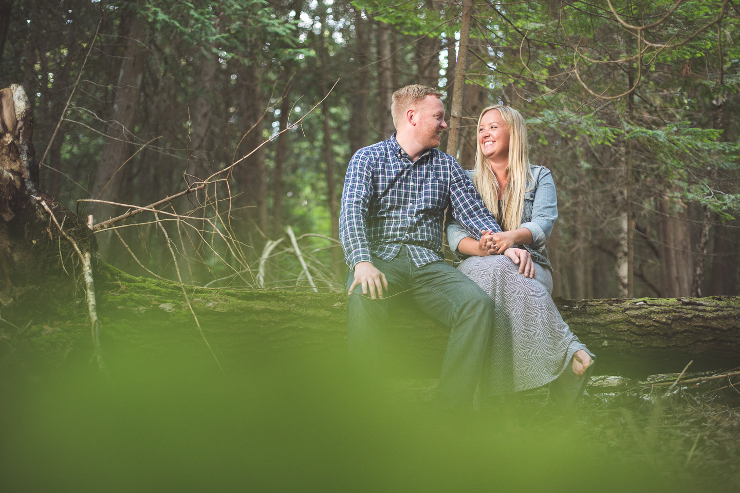 Canada-Ontario-Bruce-Peninsula-Engagement-Session-Sit-Forest-Log-Couple-Laugh
