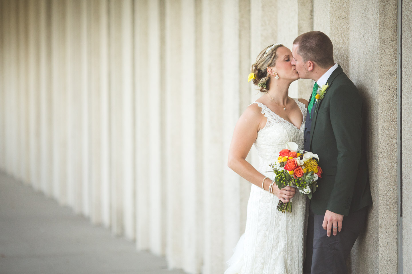 Detroit-Wedding-Wayne-State-University-College-of-Education-Bride-Groom-Kiss-At-Wall