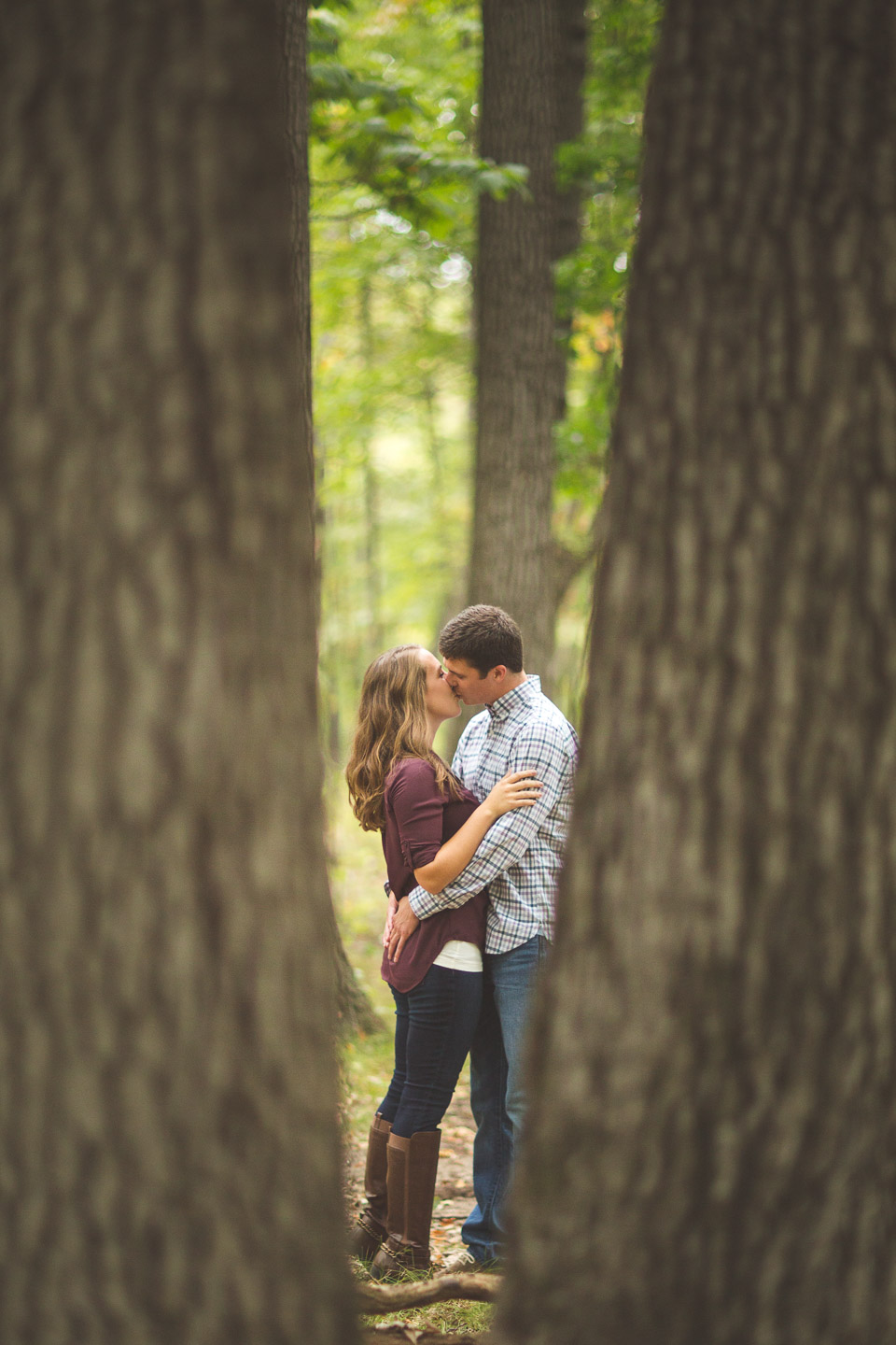 Engagement-Milford-Kensington-Metropark-Forest-Kissing-Between-Trees