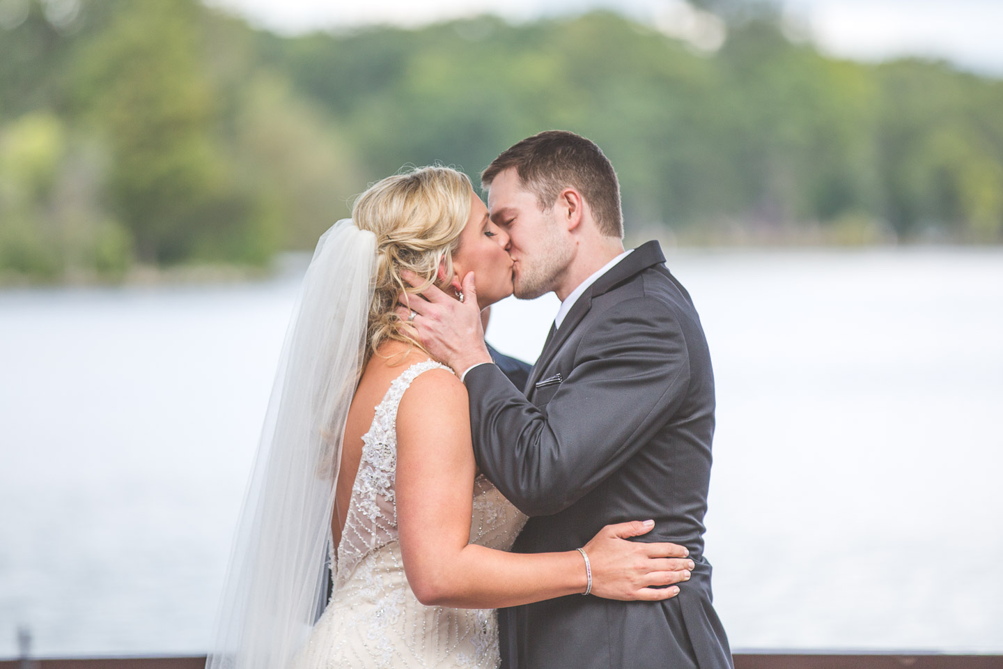West-Bloomfield-Wedding-Michigan-Bay-Pointe-Golf-Club-Outdoor-Ceremony-Bride-Groom-First-Kiss