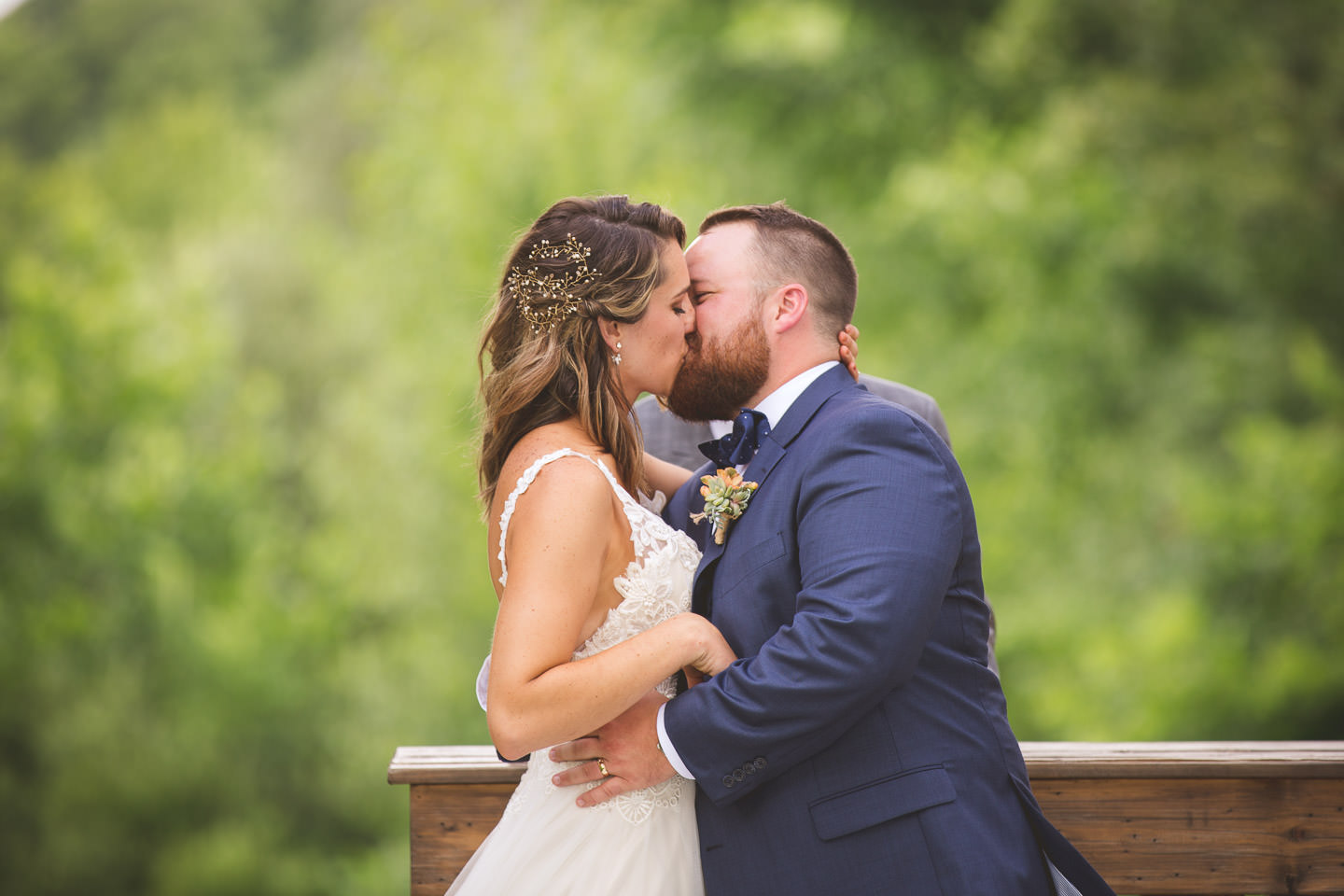Detroit-South-Lyon-Moose-Ridge-Wedding-Photographers-Ceremony-Kiss