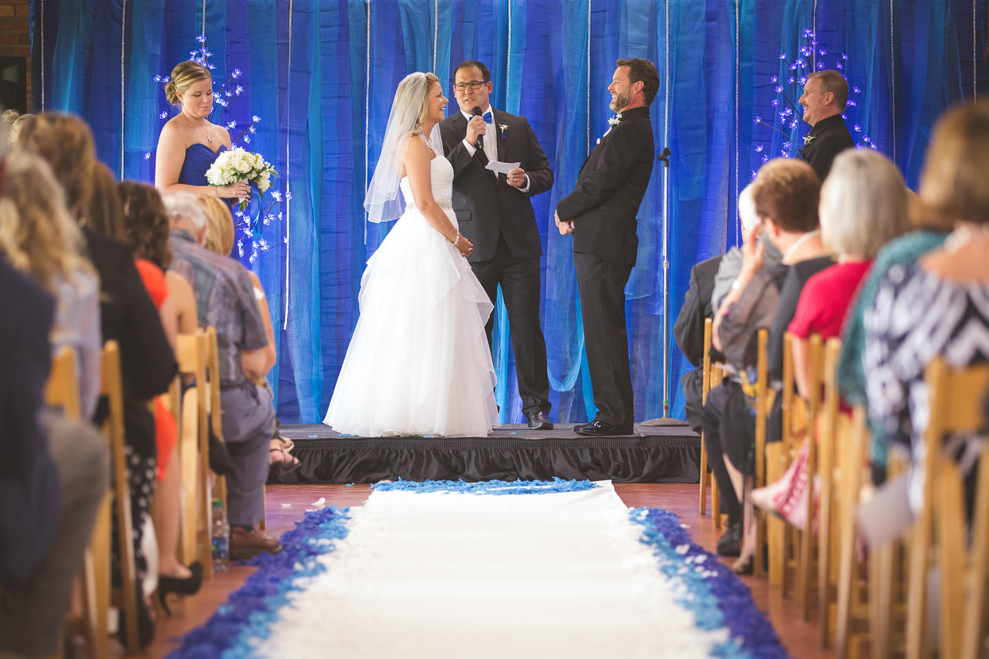 Mt-Brighton-Michigan-Wedding-Ceremony-Bride-Groom-Laugh