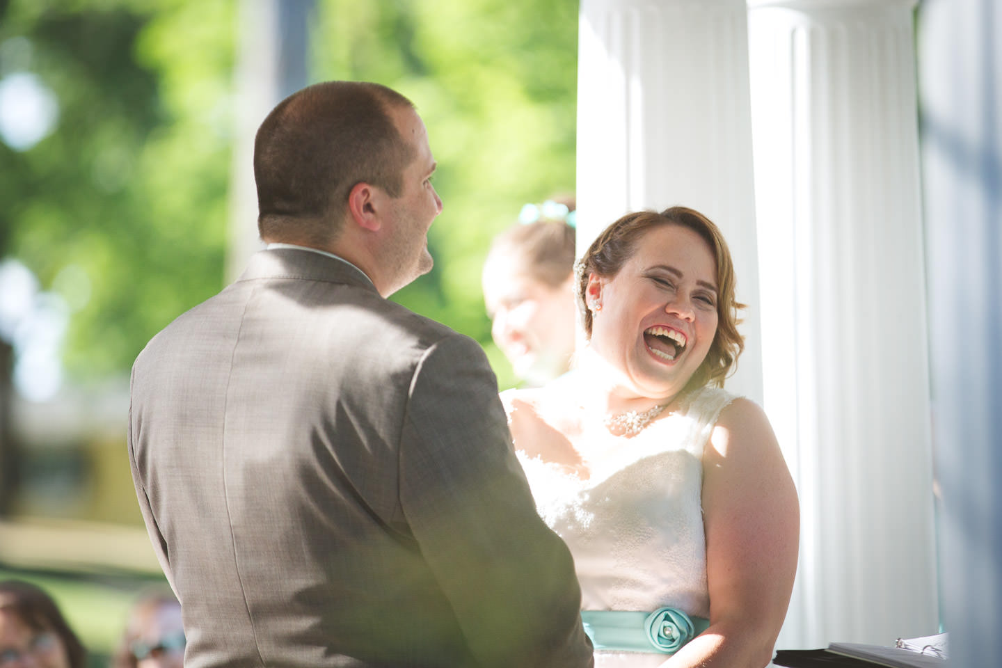 Lansing-Eaton-Rapids-English-Inn-Wedding-Ceremony-Bride-Laugh